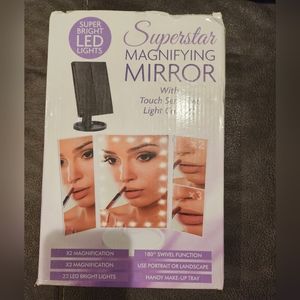 Magnifying mirror with touch sensitive light black new in box